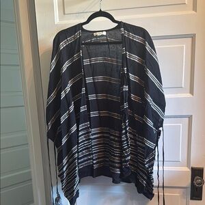 Francesca's Black and White Striped poncho jacket with tassel tie detail
